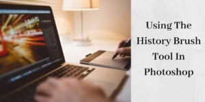 person using the history brush tool in photoshop