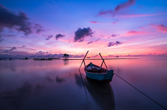 How To Photograph A Sunset - Pink and Purple Sunset with Canoe on Lake
